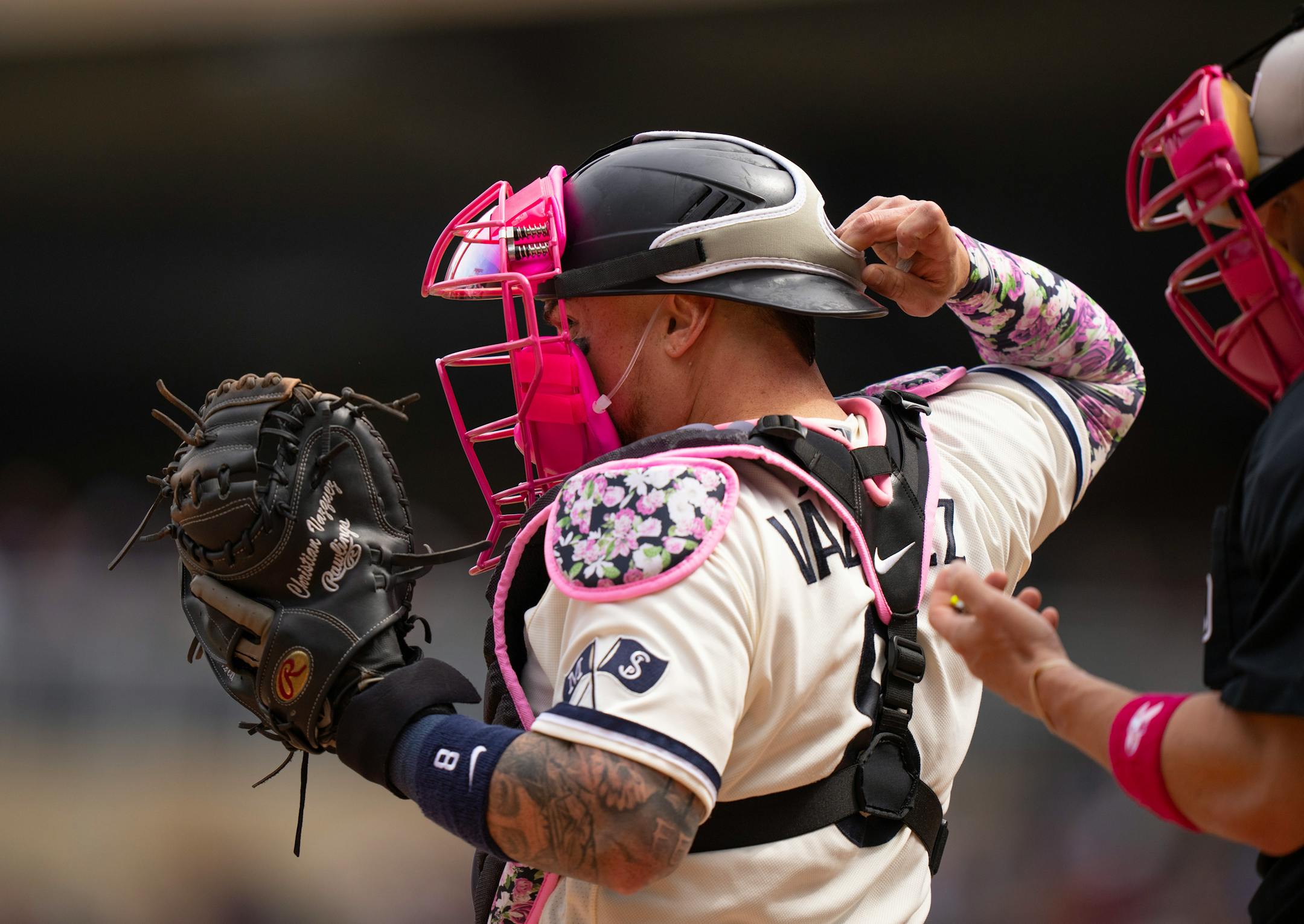 Minnesota Twins catcher Christian Vazquez put on his pink mask, in honor of Mother's Day, in the seventh inning.