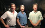 In this Friday, Sept. 14, 2018 photo, master distiller Marianne Eaves, center, is flanked by co-owners Will Arvin, right, and Wes Murray, while posing