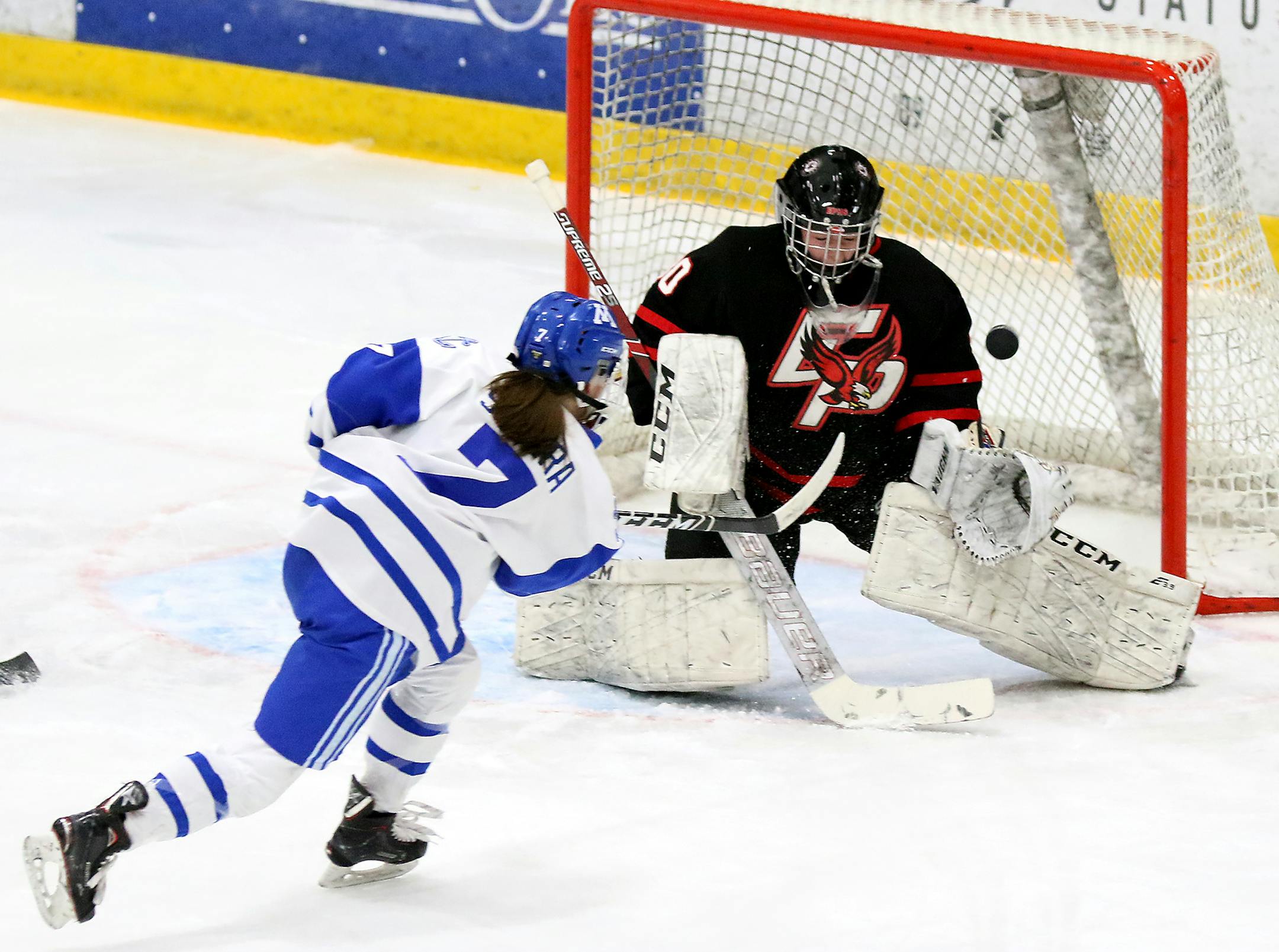 Minnetonka's Grace Sadura (7) scores on Eden Prairie goalie Moly Goergen during the first period.] DAVID JOLES • david.joles@startribune.com Girls' hockey game action, Class 2A, Section 2 final. Minnetonka vs. Eden Prairie Friday Feb. 14, 2020, at Braemar Ice Arena in Edina, MN.