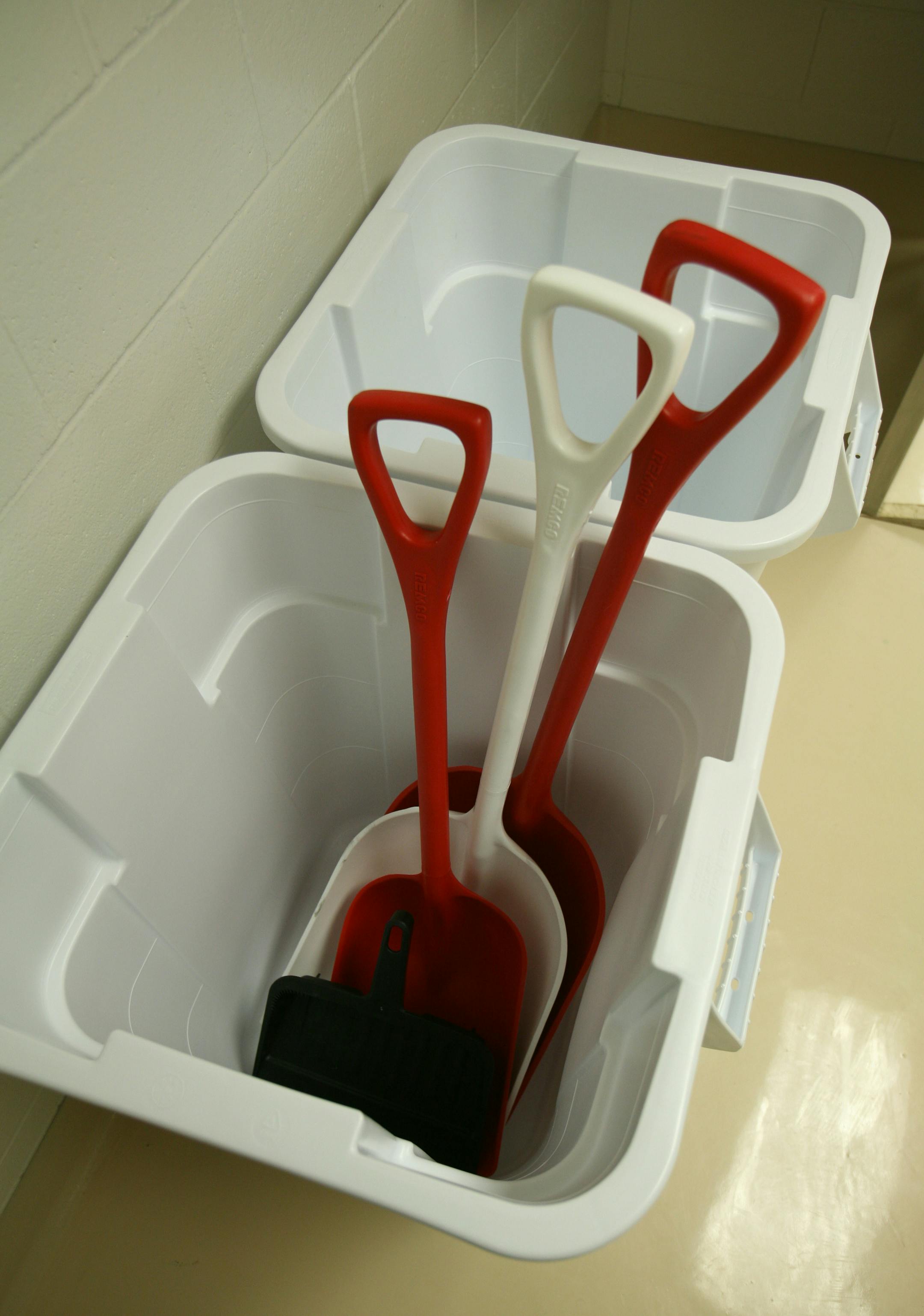 Color-coded shovels and waste bins will be used to deposit animal remains in an autoclave after necropsies.