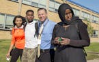 At Columbia Heights H.S., students Sherouk Mohamed,17,(orange), Karim Muse,17,(white), and Khadra Mohamed,18(black) walked out in solidarity against a