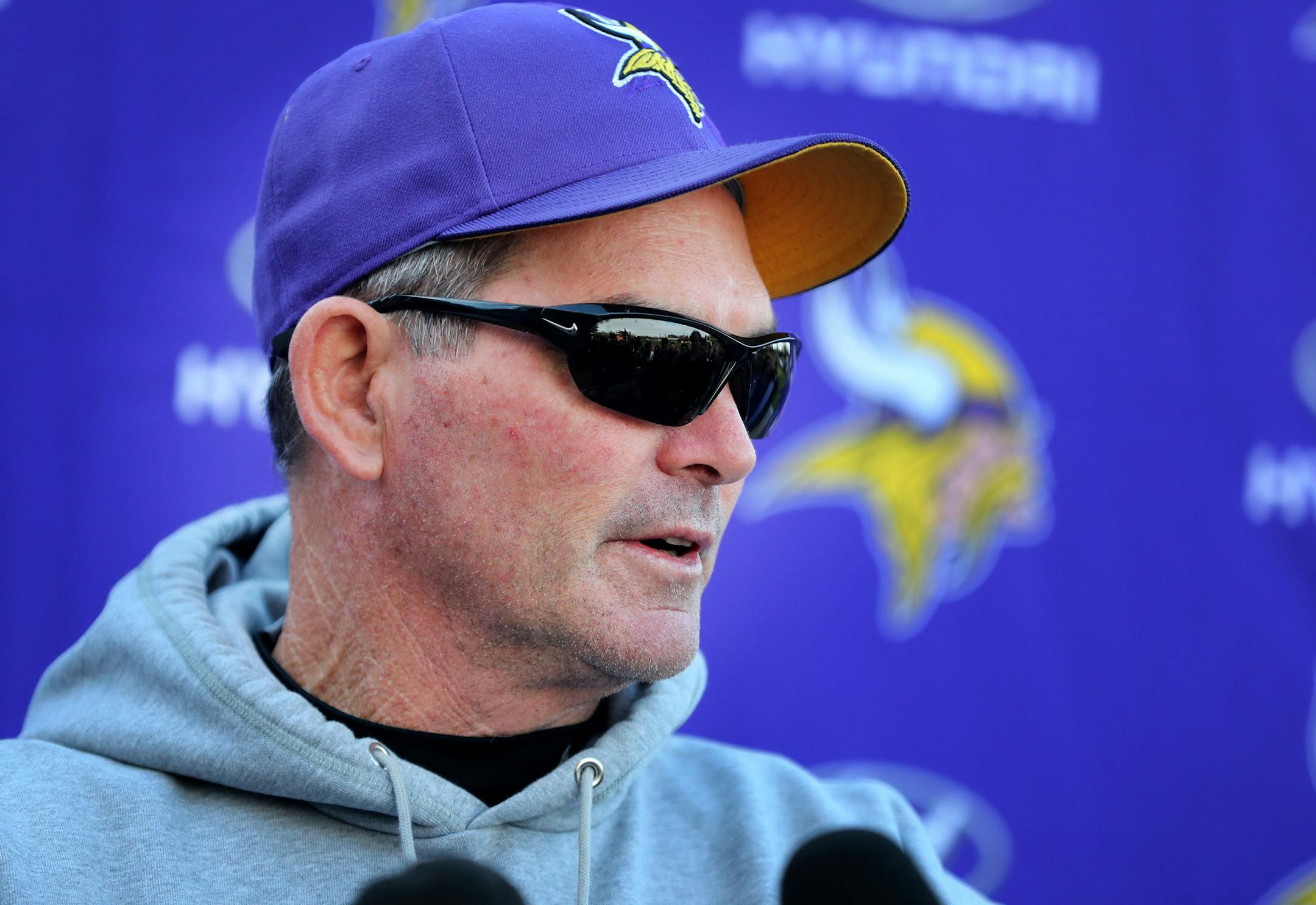 Vikings coach Mike Zimmer wore sunglasses to his news conference Wednesday, revealing he had undergone surgery the day before to repair a torn retina.