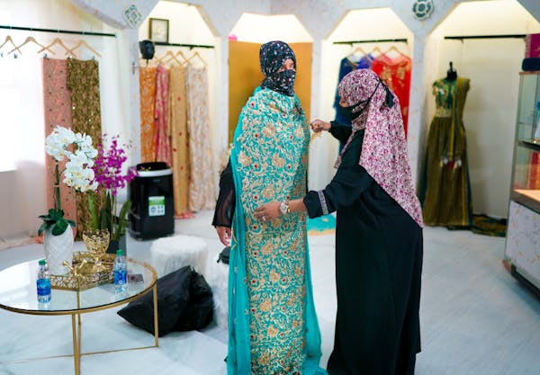 Sabrina Seyf, owner of Sabrina's Bridal, worked with a bride-to-be in her store at Karmel Mall in Minneapolis.