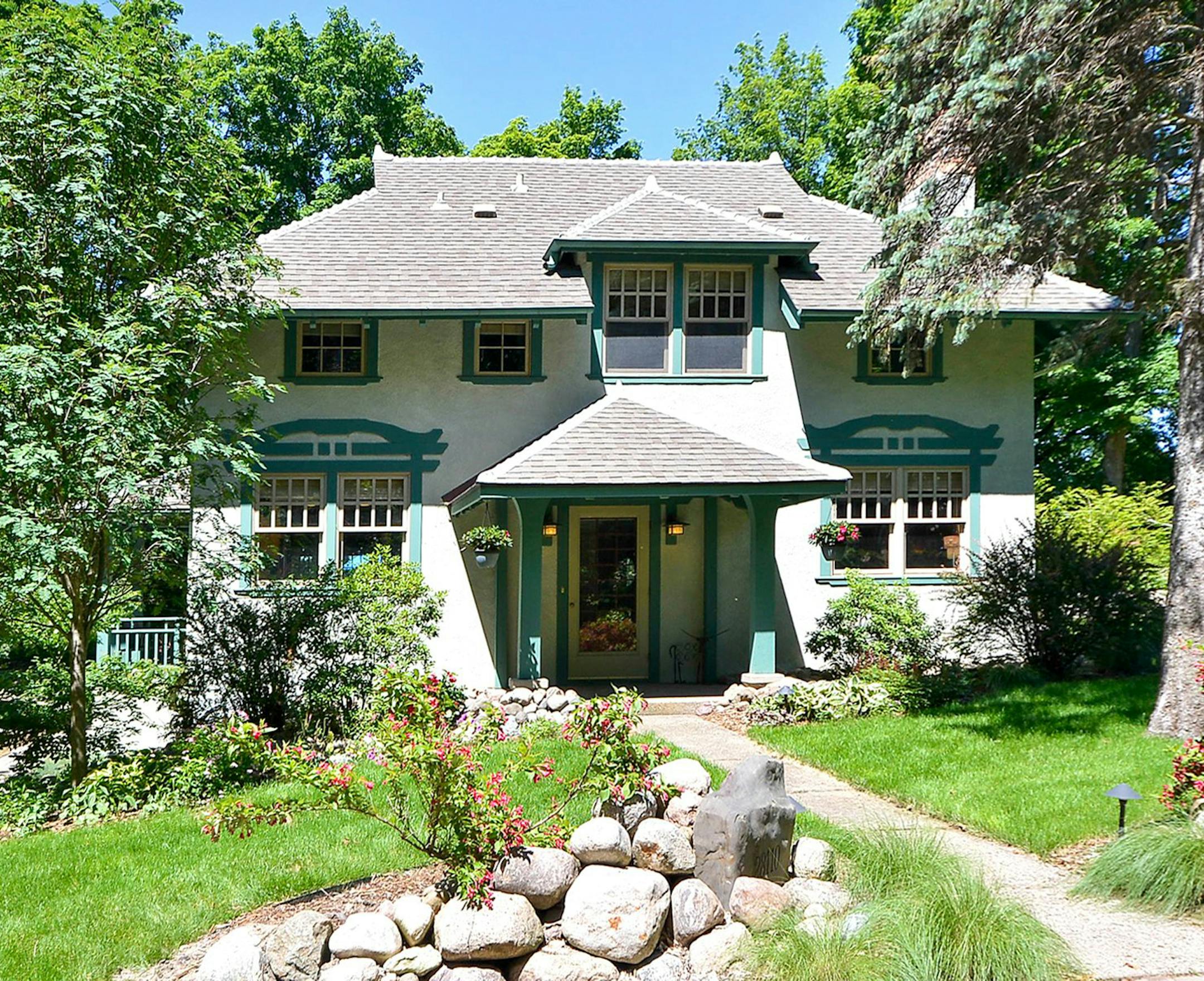 Front exterior of Arts & Crafts home for sale on Lake MInnetonka. provided by Coldwell Banker Burnet