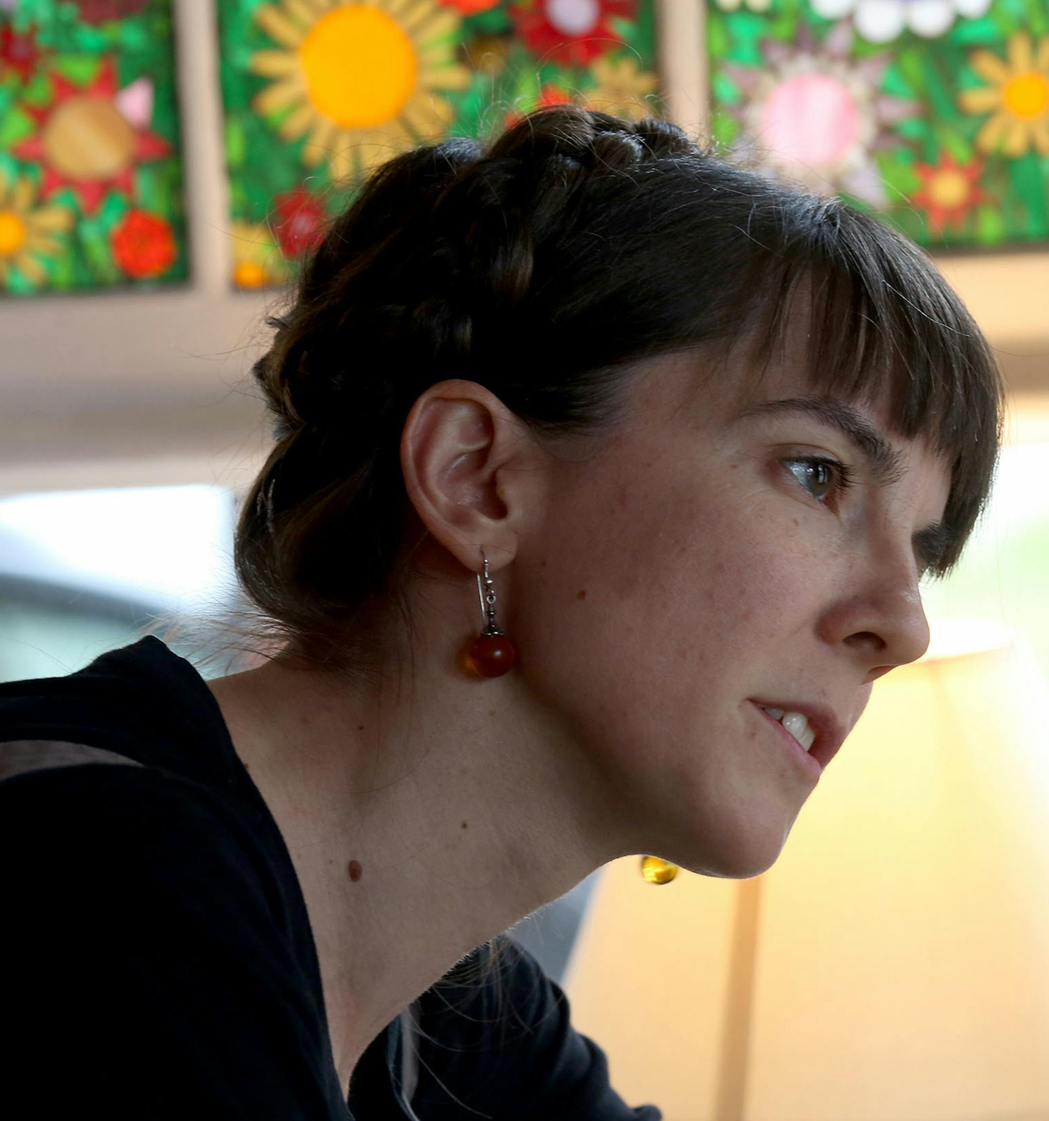 Eireann Lorsung, artist in residence, talked with Leslye Schoenhuth about her project and how she can participate in it. ] (KYNDELL HARKNESS/STAR TRIBUNE) kyndell.harkness@startribune.com Artist in residence for the Little Free Library Eireann Lorsung around the Blue Moon Coffeeshop in Minneapolis, Min. Thursday, July 24, 2014.