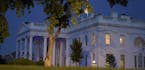 The White House is lit in blue to honor police officers killed in the line of duty on Monday, May 15, 2017, in Washington. (AP Photo/Susan Walsh) ORG 