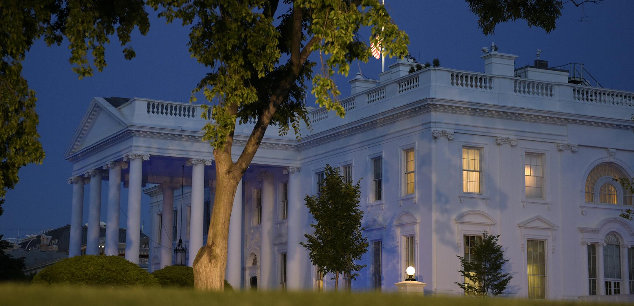 The White House is lit in blue to honor police officers killed in the line of duty on Monday, May 15, 2017, in Washington. (AP Photo/Susan Walsh) ORG XMIT: DCSW121