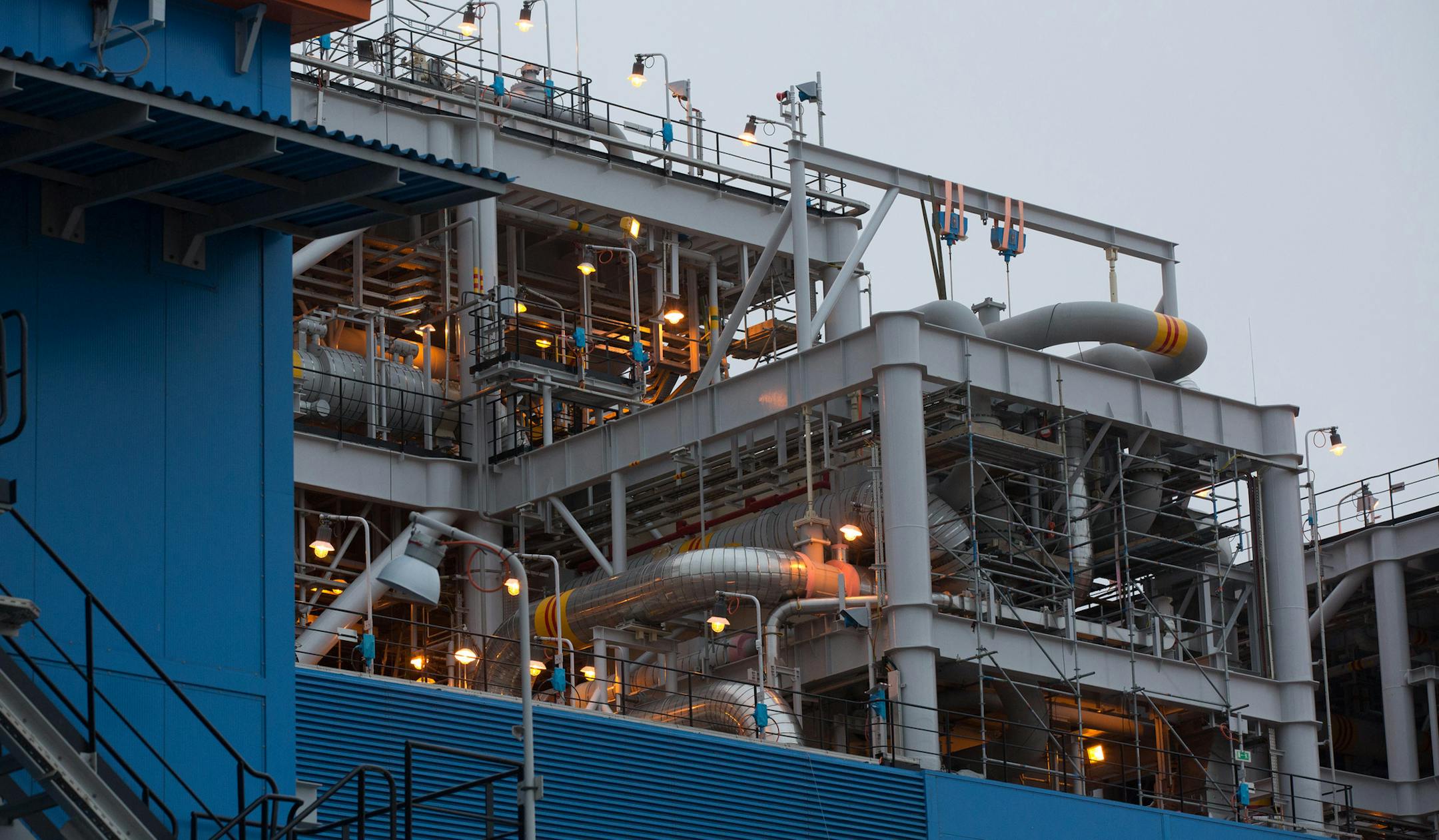 Electric lights illuminate pipework at one of the liquefied natural gas facilities at the Yamal LNG plant, operated by Novatek PJSC, in Sabetta, Russia, on Aug. 8, 2018. MUST CREDIT: Bloomberg photo by Andrey Rudakov ORG XMIT: 775208130