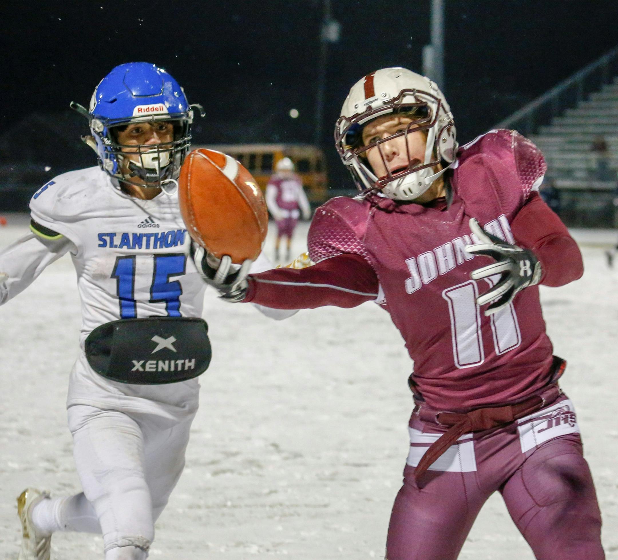 St. Paul Johnson's Luke Moberg pulls in a pass along the sideline to set up a third quarter touchdown against St. Anthony Village. The Governors scored 16 unanswered points in the second half to defeat the Huskies 24-22. Photo by Jeff Lawler, SportsEngine