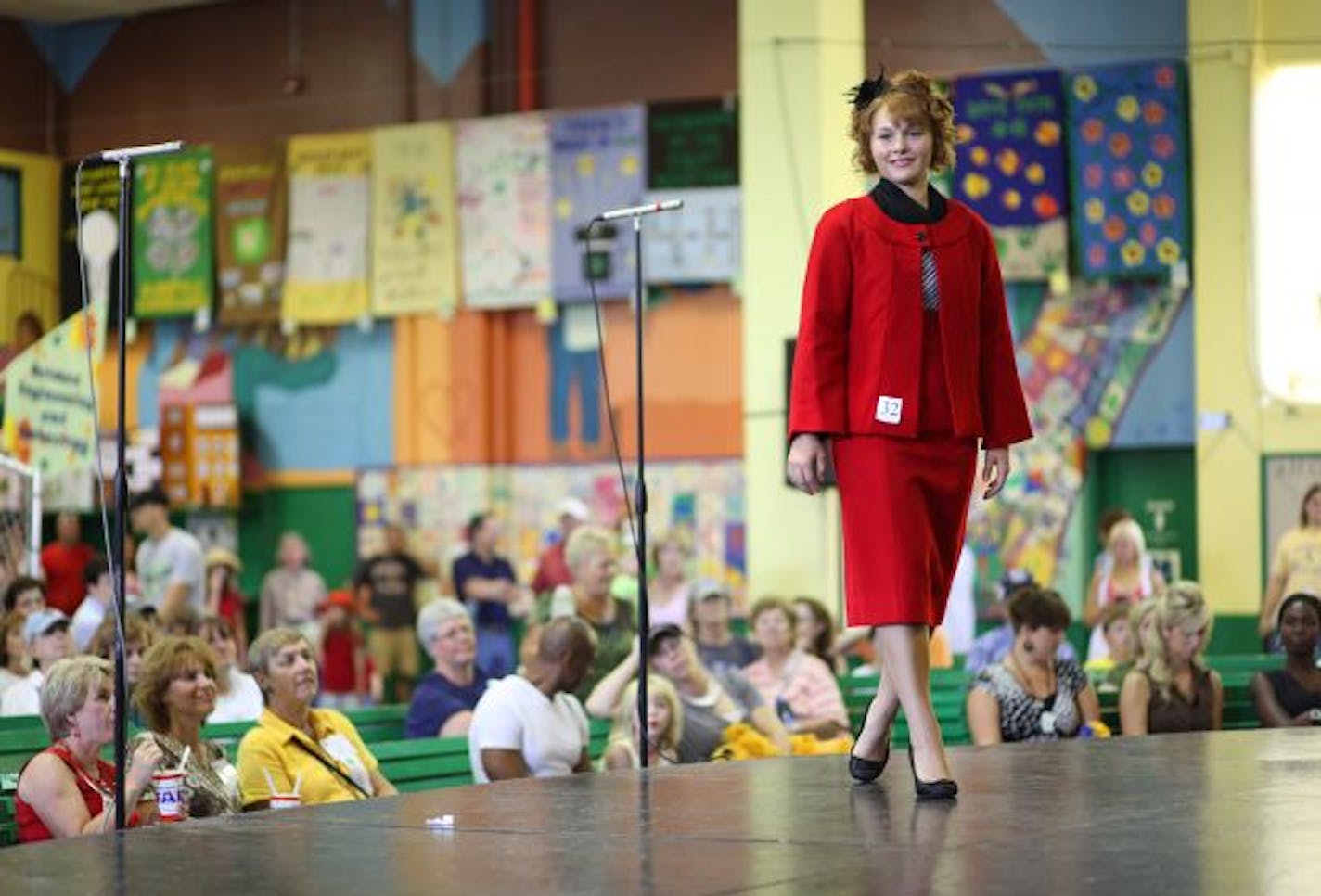 On the stage in the 4-H Building, Brittney Carlson took a spin on the makeshift runway, modeling the two-piece wool suit she made for the 4-H Fashion Revue.