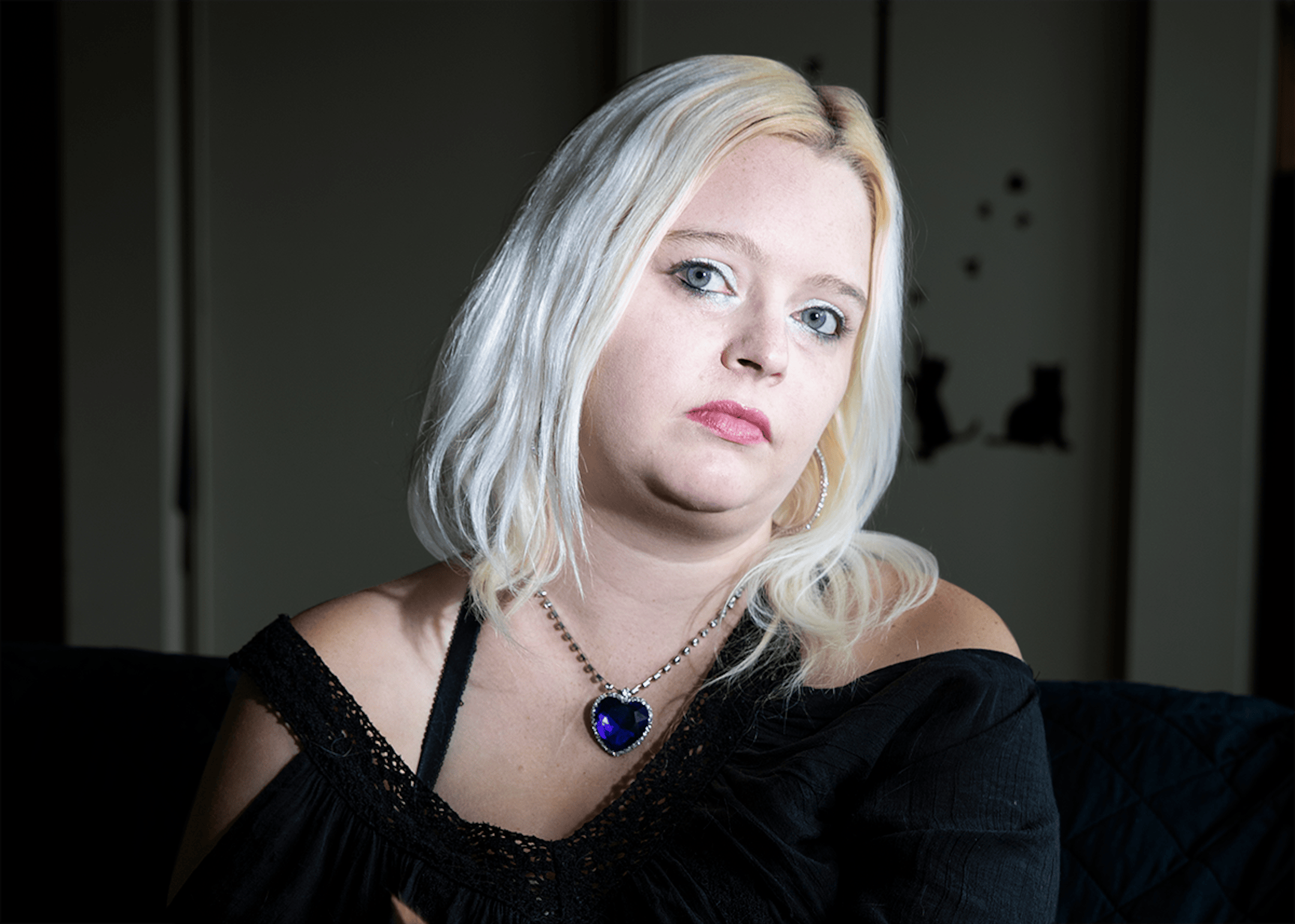 Alesha Erickson was photographed in her apartment with her cat on September 21, 2018 in Mountain Iron, Minn. She was raped in a different unit in the building and moved to a new apartment after the rape.