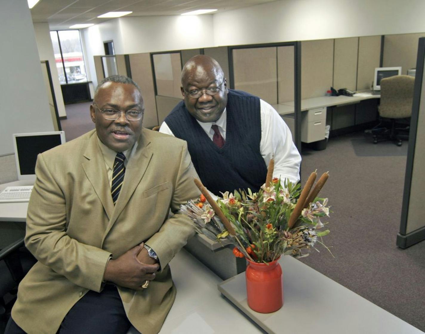 TOM SWEENEY � tsweeney@startribune.com Minneapolis, MN 11/11/2005 Dr. John Williams, ( left) and Ezell Jones ( right) business partners in the second floor of a Broadway Av building they renovated into " Renaissance Center" a plave for start-up businesses to 'office',- they are also buying Jerry's Flower Shop, scene of a 2004 murder/robbery to develop in partnership with U of M programs