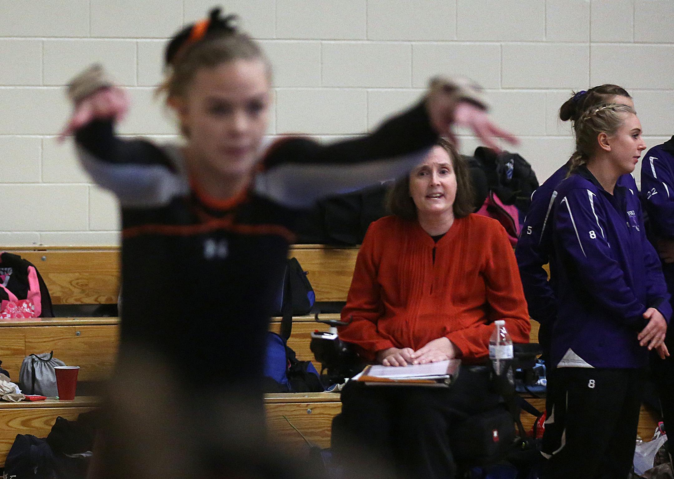 Gymnastics coach Colleen Stark-Haws watched athletes on the St. Cloud Tech team compete at the Class 2A, Section 8 Meet in St. Michael. Longtime St. Cloud Tech gymnastics coach Colleen Stark-Haws is battling MS, even as her health declines,. The team is expected to contend at the state meet this year. Stark-Haws uses a wheelchair and her condition makes it difficult for her to use her arms. ] JIM GEHRZ ï james.gehrz@startribune.com / Minneapolis, MN / February 12, 2016 /9:30 PM ñ BACKG