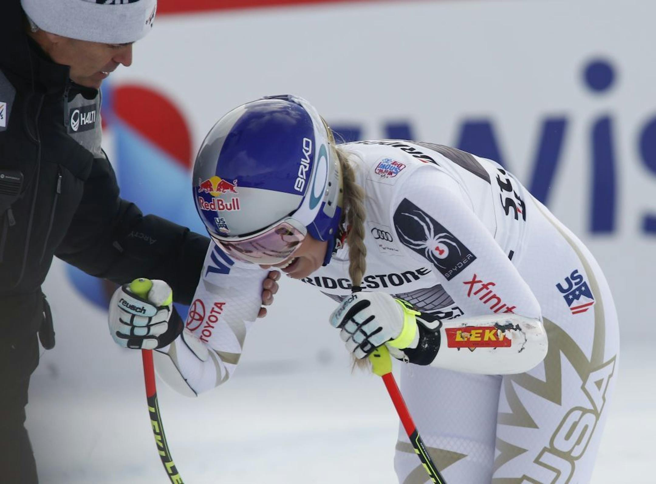 United States' Lindsey Vonn grimaces in pain after getting to the finish area after completing an alpine ski, women's World Cup super-G, in St. Moritz, Switzerland, Saturday, Dec. 9, 2017.