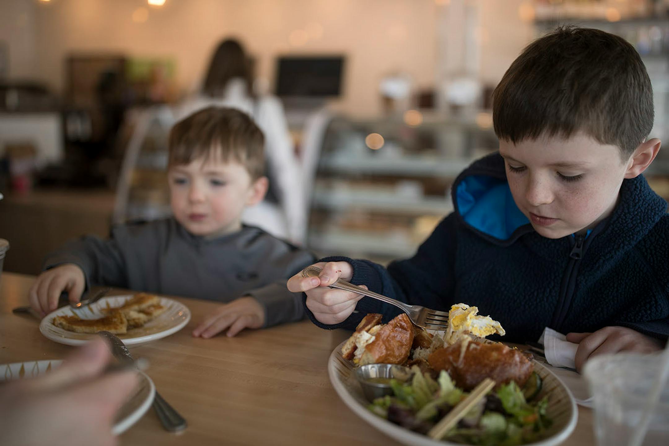 Declan Kolkman 3, left and his brother Kane Kolkman 9, enjoyed breakfast with their dad Ben Kolkman at the Lucky Oven, Feb 9, 2018 in Minneapolis, MN.
