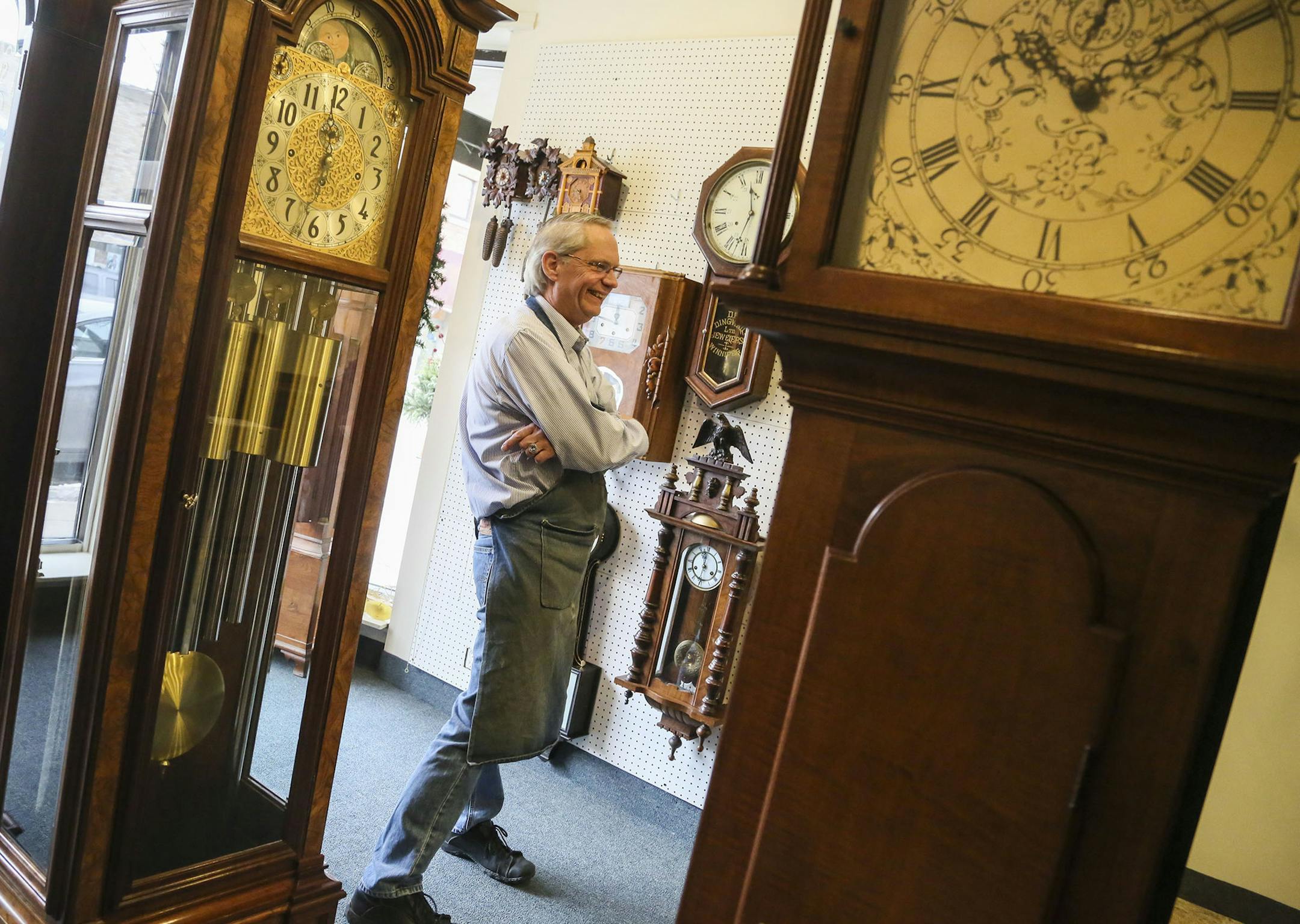 Blackstone Manor Clock Repair owner Mark Purdy with some of his prized clocks Tuesday, Dec. 2, 2014, in Hopkins, MN.](DAVID JOLES/STARTRIBUNE)djoles@startribune.com A Hopkins storefront jammed with gears, springs and ancient, intricately carved woodwork is the unlikely site of one of the nation's leading restorers and repairers of collectible clocks. We visit Blackstone Manor Clock Repair and owner Mark Purdy to find out what makes him tick.**Mark Purdy,cq