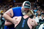 It's common to see wrestlers and their supporters share moments at the high school wrestling state championships.