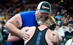 It's common to see wrestlers and their supporters share moments at the high school wrestling state championships.