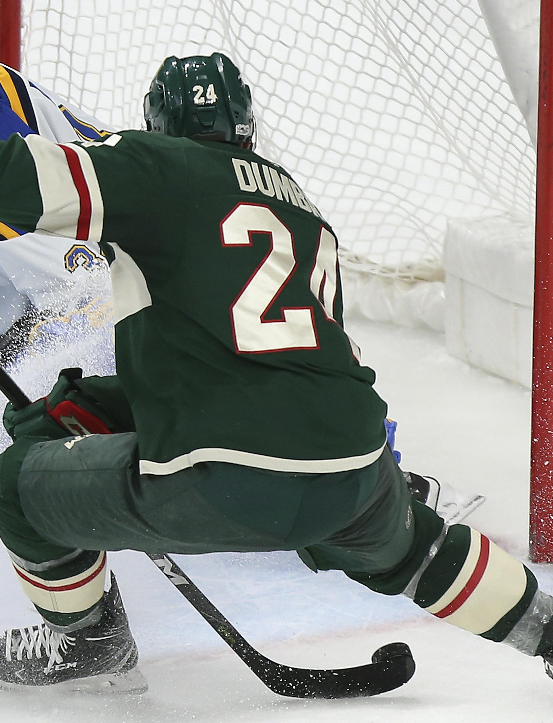 Minnesota Wild's Matt Dumba (24) lines up the game winning shot against St. Louis Blues' goalie Jake Allen (34) in overtime in an NHL hockey game Saturday, Dec. 2, 2017, in St. Paul, Minn. The Wild won 2-1. (AP Photo/Stacy Bengs)