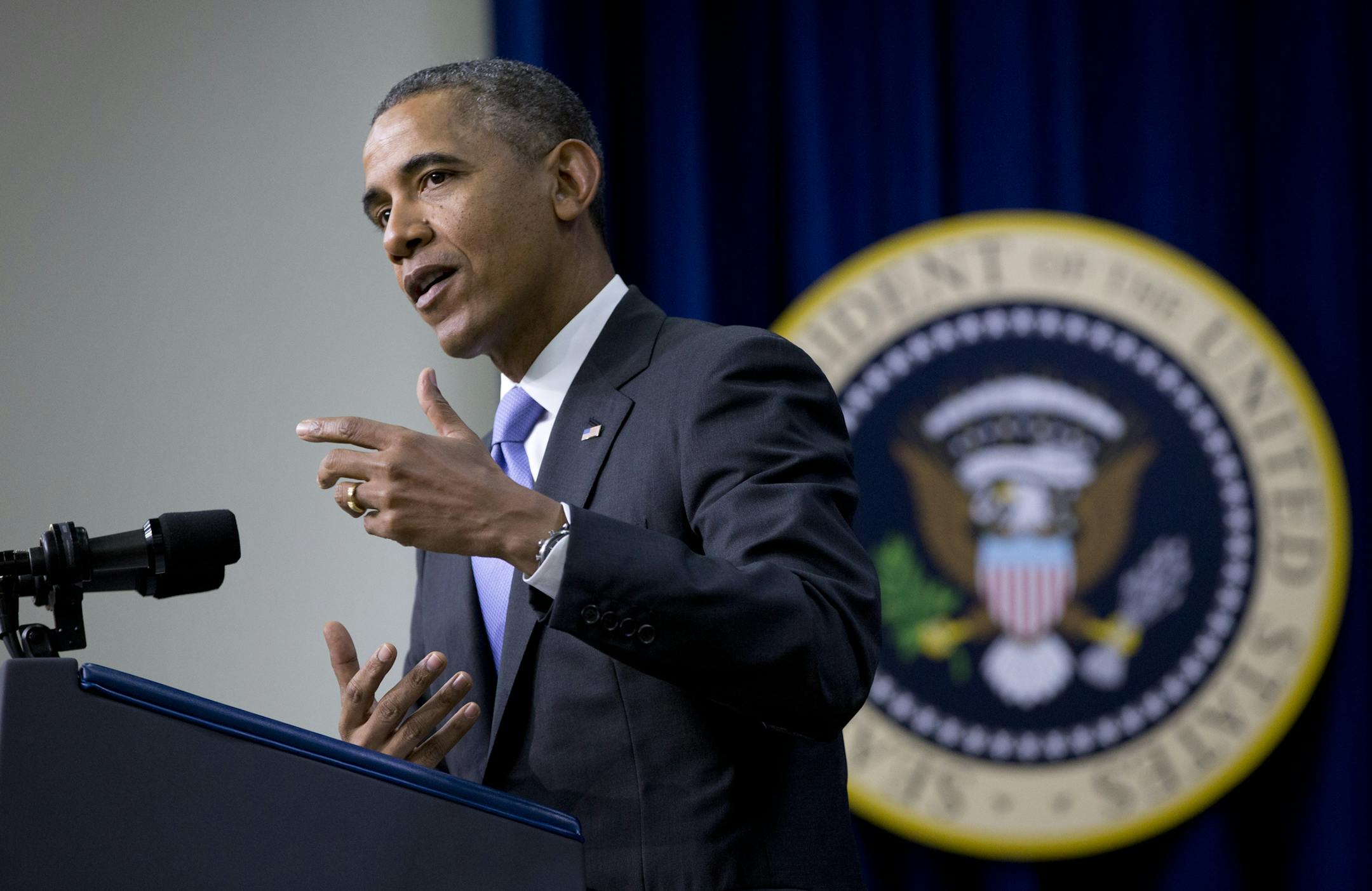 President Barack Obama gestures as he speaks during an Expanding College Opportunity event in the South Court Auditorium in the Eisenhower Executive Office Building on the White House complex, Thursday, Jan. 16, 2014, in Washington. (AP Photo/Carolyn Kaster)