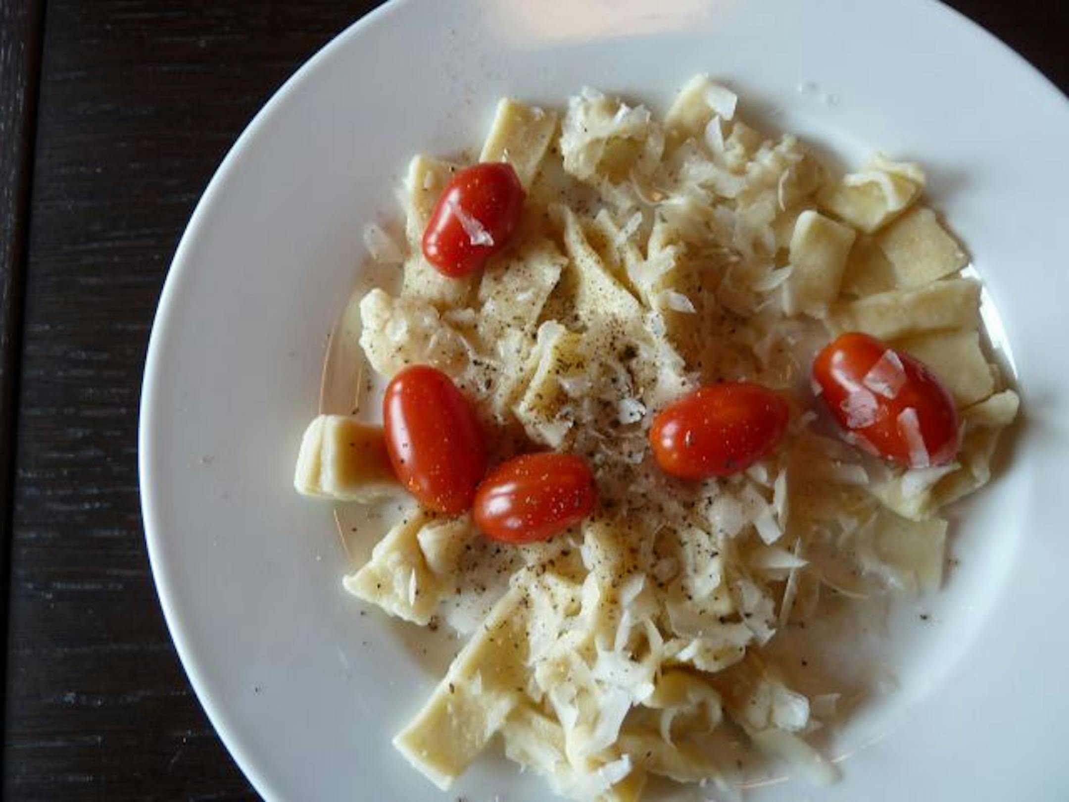 A serving suggestion: Homemade noodles served with tomatoes and cheese.