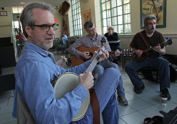 (left to right) Craig Evans played the banjo with Kurt Olson, Joe Fishbein and other band members Saturday morning, 4/27/13, at Black Bear Crossings o
