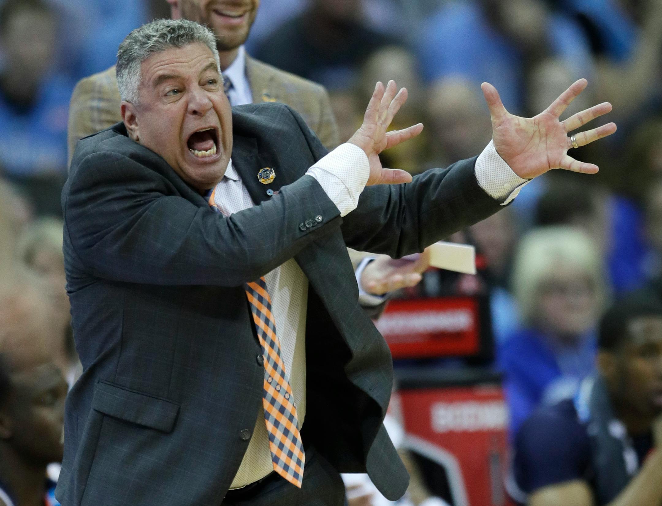 Auburn head coach Bruce Pearl yells from the sidelines during the region semifinal game vs. North Carolina