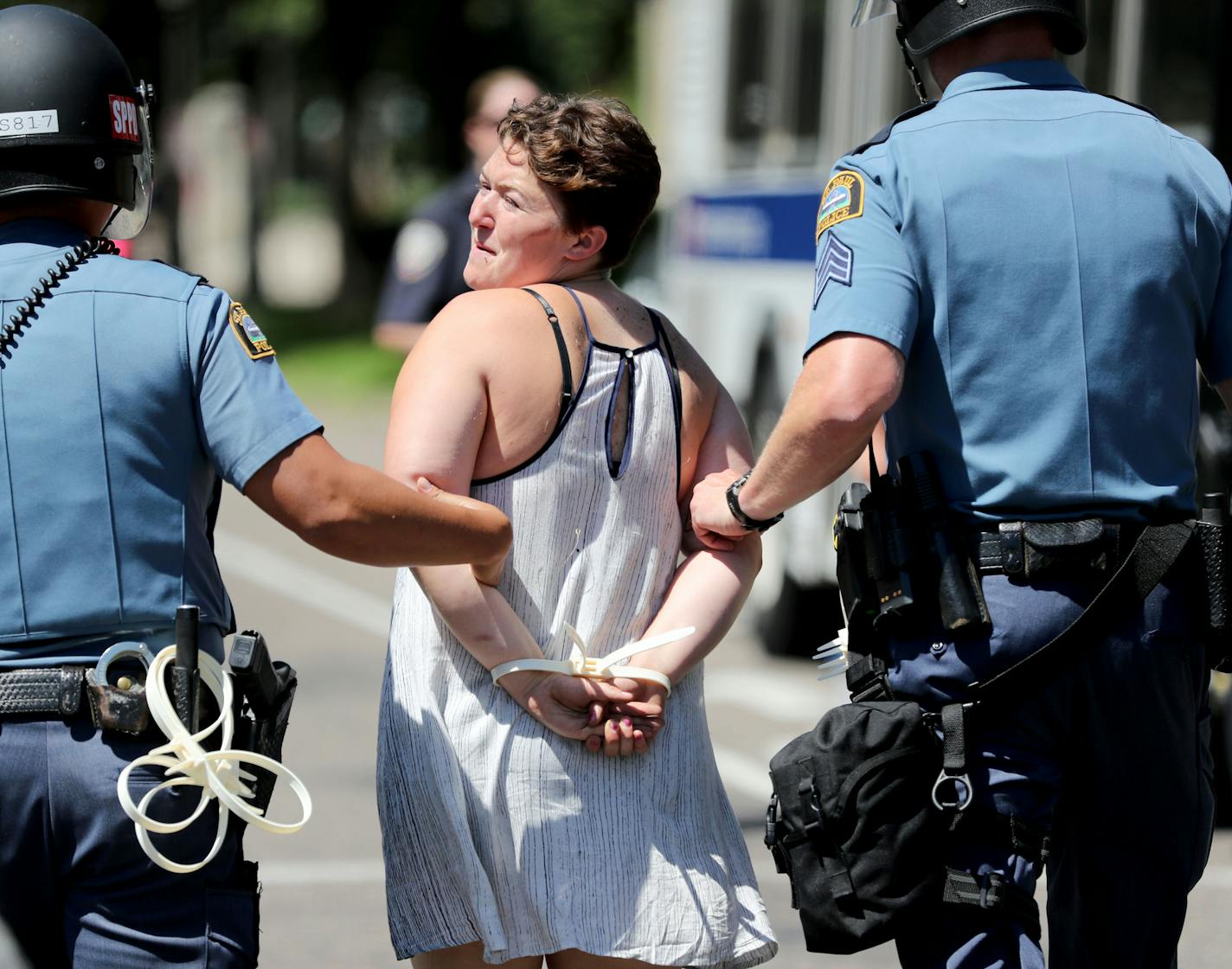 A protestor is taken into custody near the Gov. Mark Dayton's mansion Tuesday, July 26, 2016, in St. Paul, MN. Earlier in the day police made the first arrests of protestors after driving protestors from outside the mansion before protestors reclaimed their spot.](DAVID JOLES/STARTRIBUNE)djoles@startribune Protesters were ordered Tuesday to clear the street and sidewalk in front of the governor's residence, where they have been since the fatal police shooting of Philando Castile nearly three wee