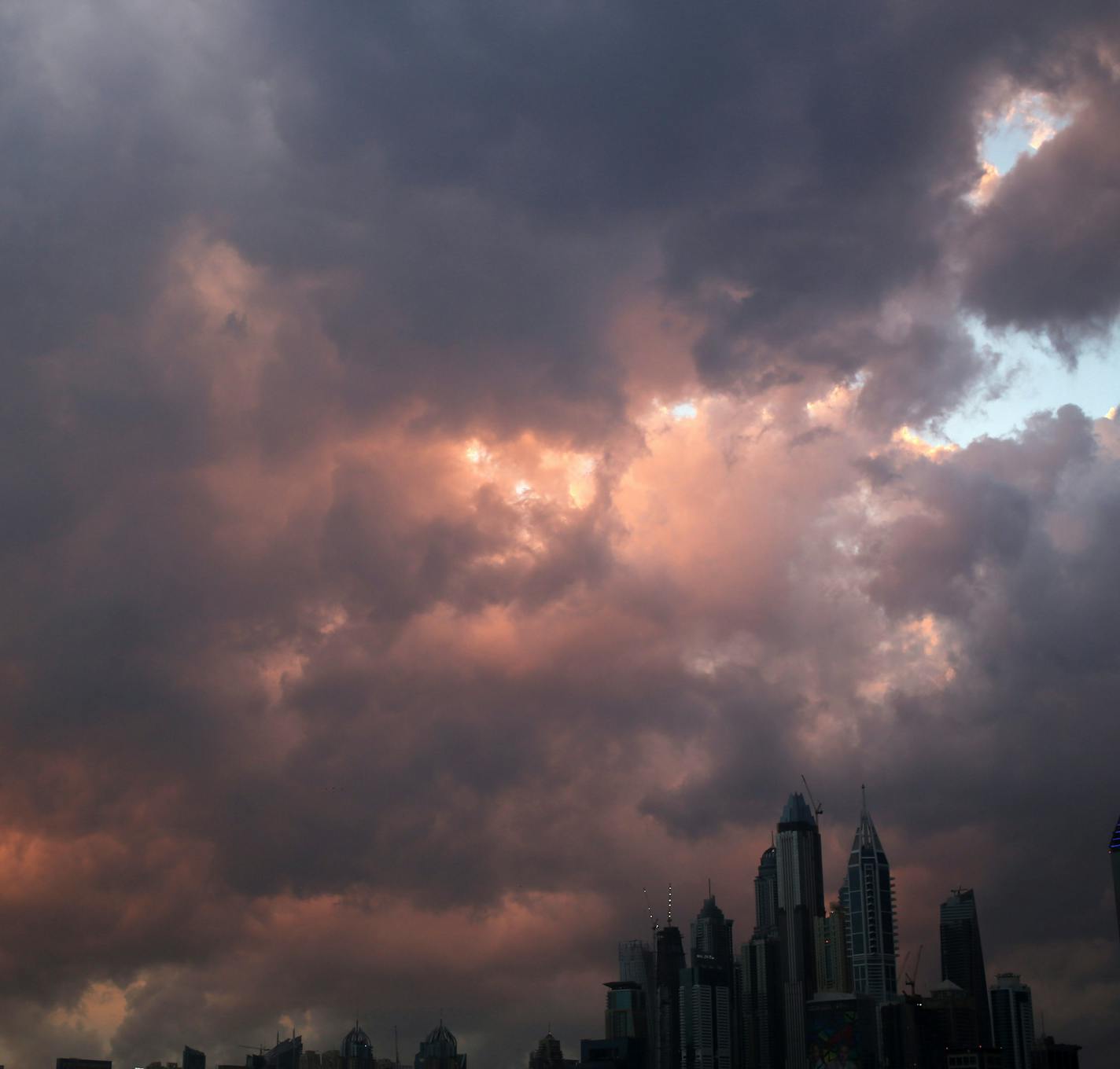 A rare thunderstorm passes over the Dubai Marina and Jumeirah Lake Towers neighborhoods of Dubai, United Arab Emirates, on Wednesday, Feb. 17, 2016. (AP Photo/Jon Gambrell)