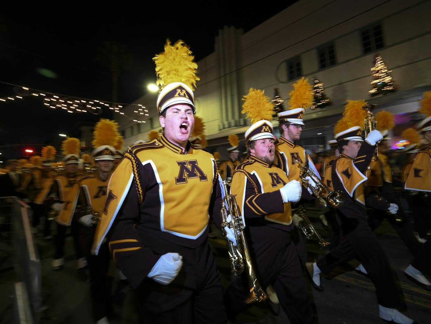 The University of Minnesota Marching Band made its way through Ybor City during Tuesday night's parade. ] Aaron Lavinsky &#x2022; aaron.lavinsky@startribune.com The Outback Bowl's New Year's Eve parade was held Tuesday, Dec. 31, 2019 in historic Ybor City in Tampa, Fla. The parade featured marching bands from around the country, including Armstrong and Edina High Schools, as well as a competition between the Auburn and University of Minnesota Marching Bands.