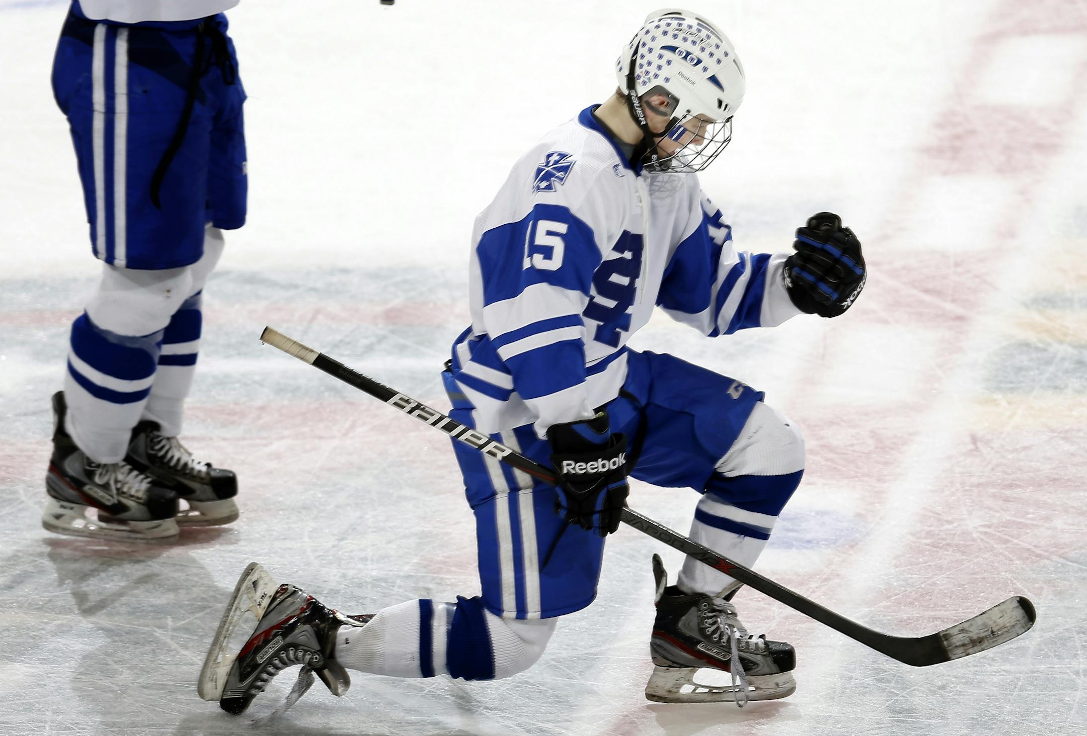 Tommy Novak (15) celebrated after scoring he go-ahead goal in the third period. St. Thomas Academy beat Hermantown by a final score 5-4.