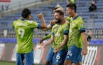 Seattle Sounders midfielder Joao Paulo (6) celebrates with forward Raul Ruidiaz (9) and midfielder Josh Atencio, right, after Paulo scored a goal agai