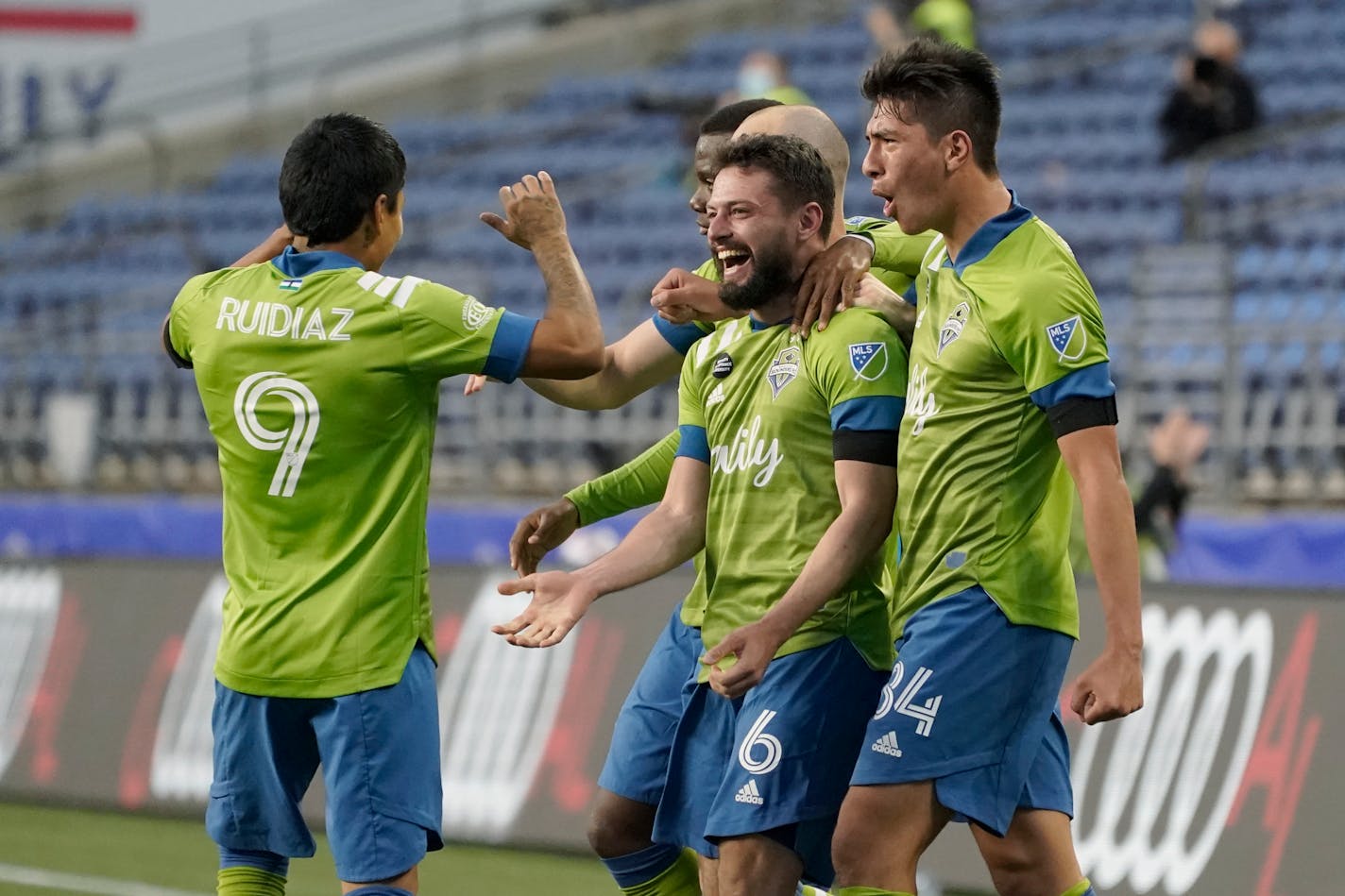 Seattle Sounders midfielder Joao Paulo (6) celebrates with forward Raul Ruidiaz (9) and midfielder Josh Atencio, right, after Paulo scored a goal against Minnesota United during the second half.