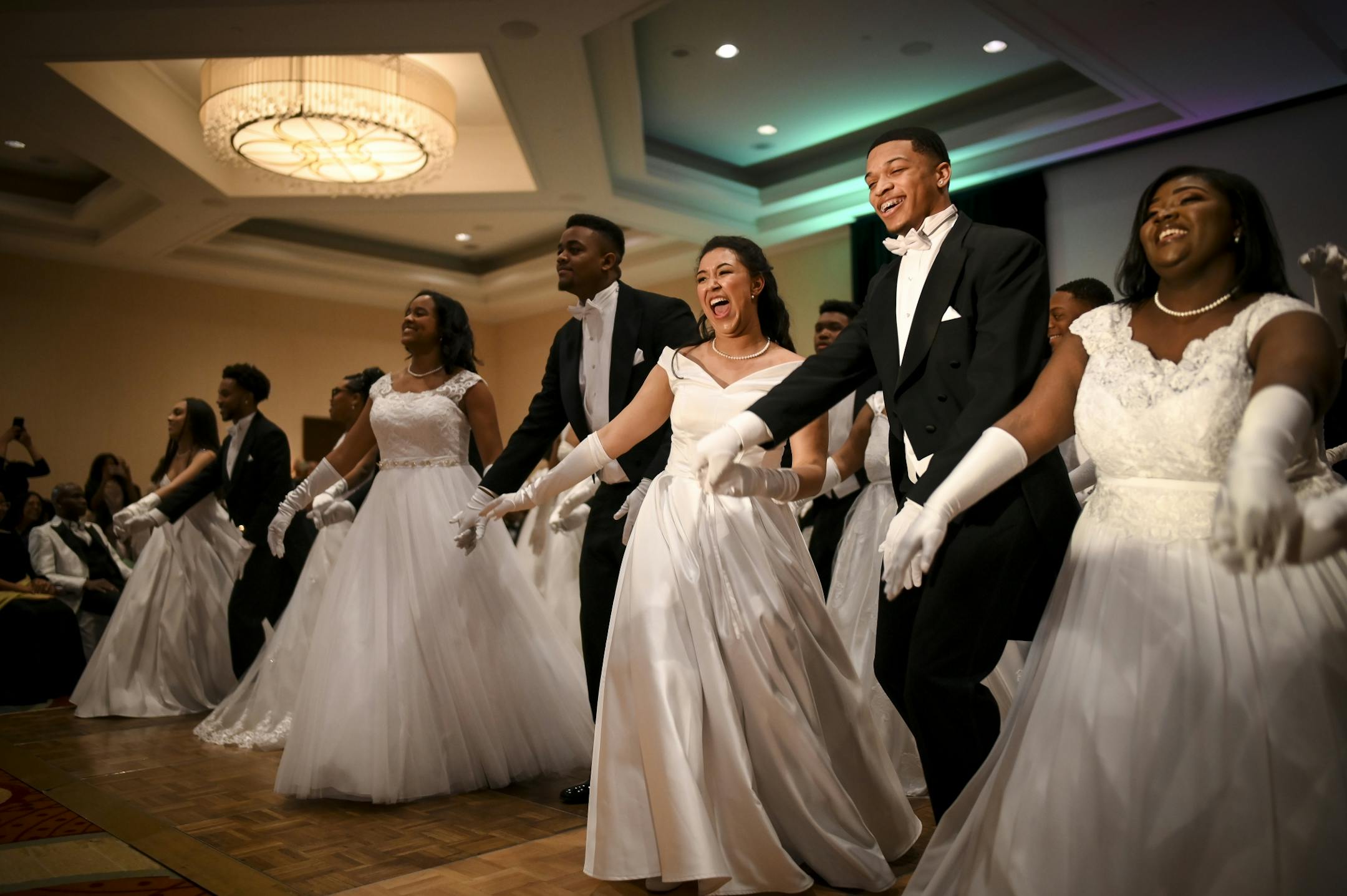 Lillyan Stuart, a junior at Roseville, danced with her escort, AJ Scaife, with their fellow debutantes and escorts to "Nosotros in Jazz" by Kazumi Totaka.