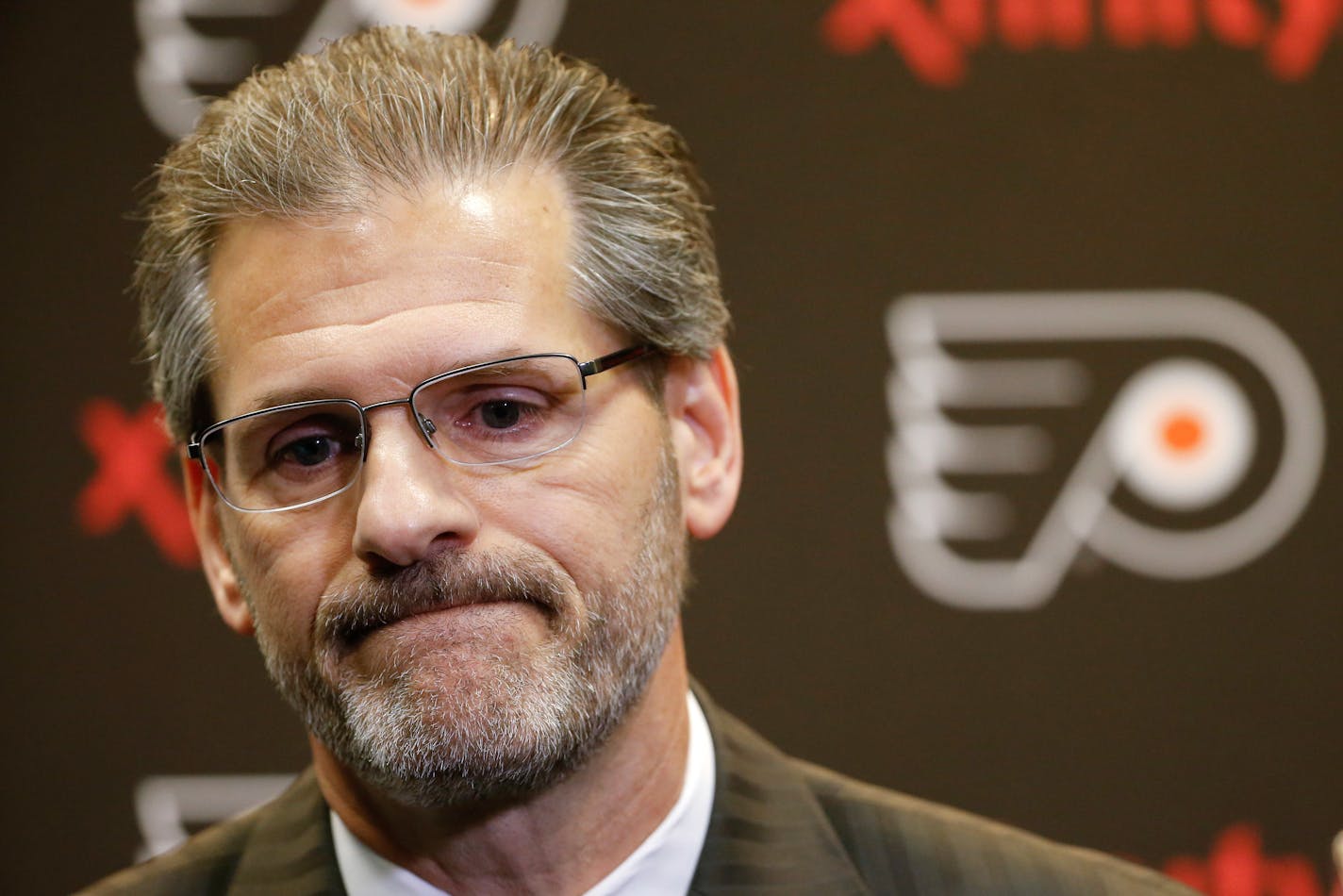 FILE - In this April 11, 2016, file photo, Philadelphia Flyers general manager Ron Hextall speaks with members of the media during a NHL hockey news conference in Voorhees, N.J. The Flyers fired Hextall on Monday, Nov. 26, 2018. (AP Photo/Matt Rourke, FIle)