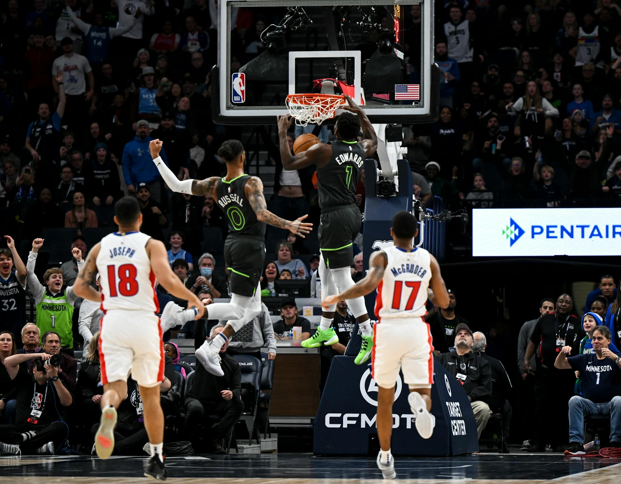 Minnesota Timberwolves guard Anthony Edwards (1) dunks the ball off a breakaway during the first half.