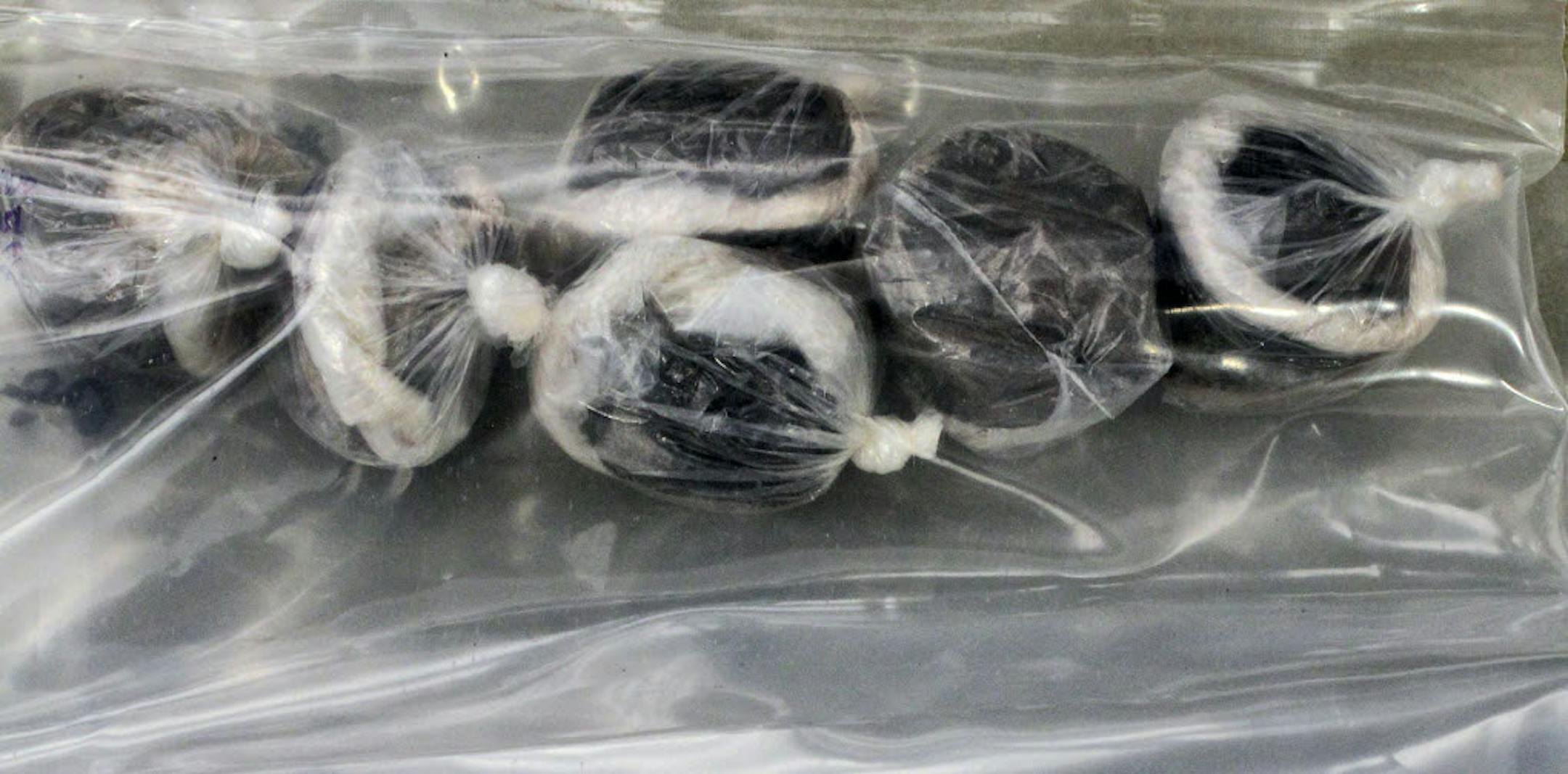 Bags of individually wrapped balls of heroin called Black Tar were found hidden in an air conditioner in a Brooklyn Center hotel.