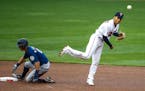 Minnesota Twins shortstop Andrelton Simmons forces out Seattle Mariners' Sam Haggerty and turns a double play on a ball hit by J.P. Crawford in the se