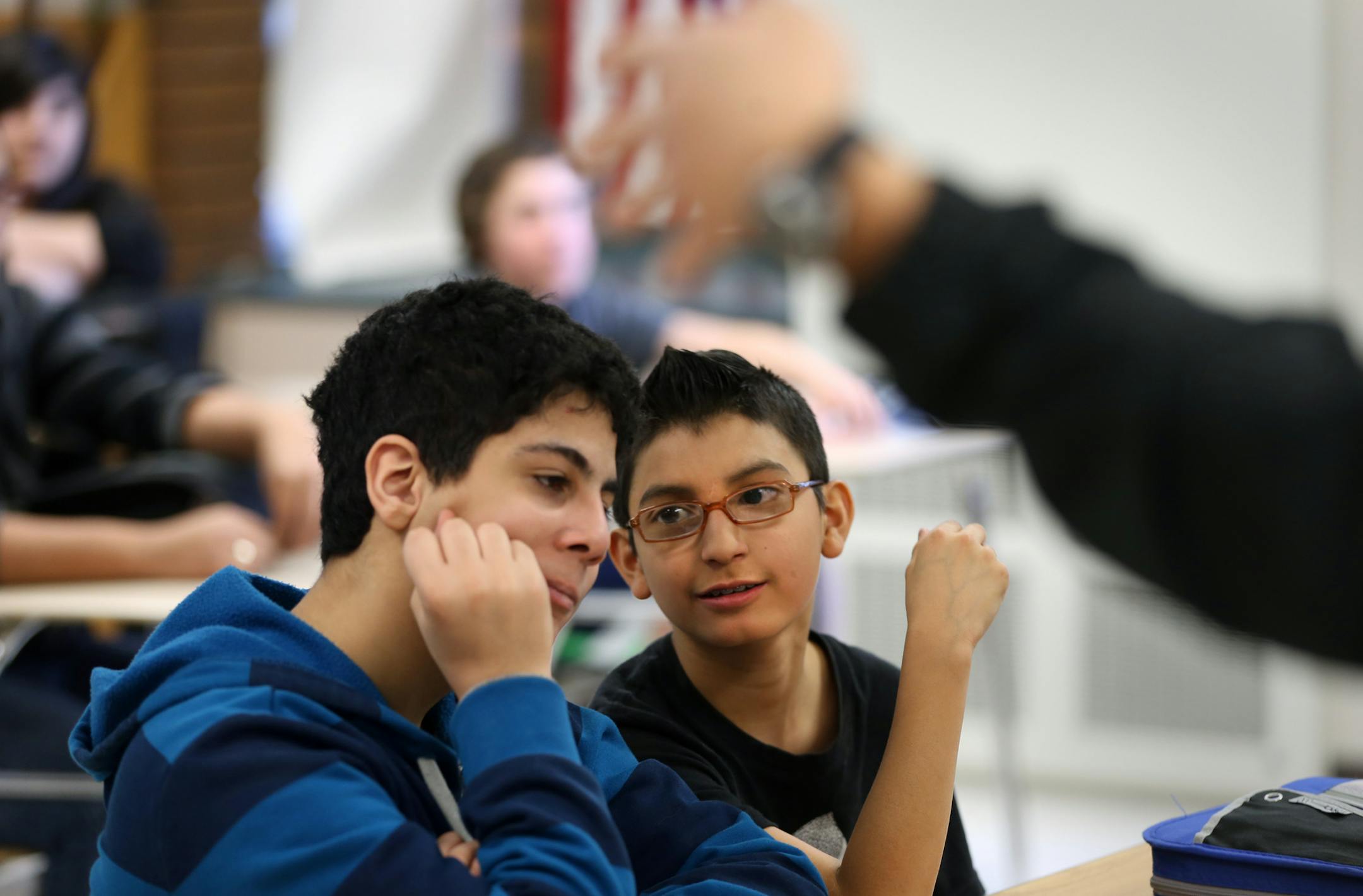 (left to right) Dante Tashtoush and Jason Espinoza worked on outlines during Teacher Adam Iverson's 8th grade U.S. History Class, at Nicollet Junior High School in Burnsville on 1/29/14. The Burnsville and Lakeville districts have recently created their third integration plan via their Multi-District Collaborative Council. The plans are designed to encourage students from each district to attend school in the other, balancing out demographics. Creation of the first plan was mandated by the state