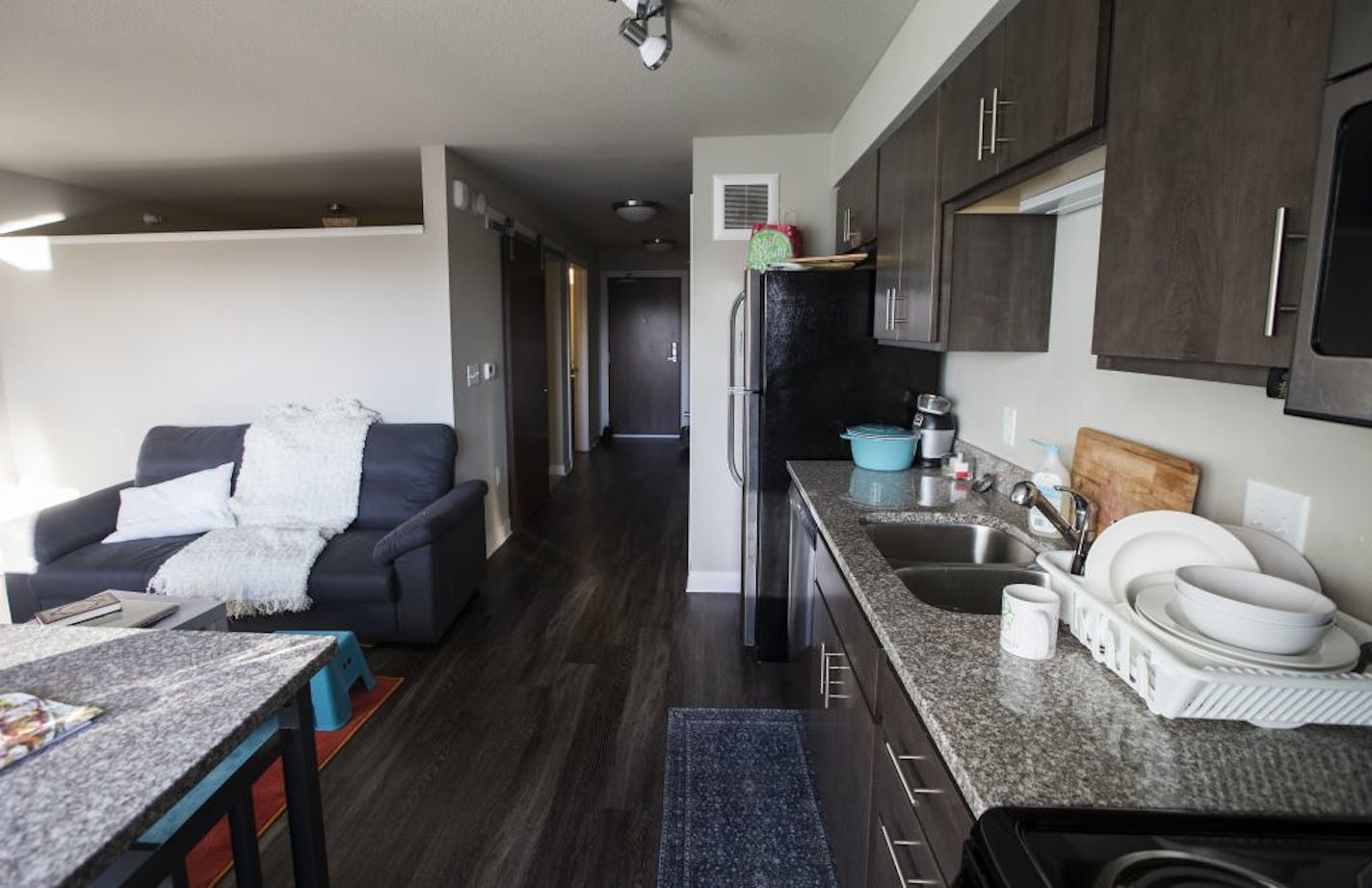 The kitchen/dining room/living in the 529 square foot lilac floor plan at Chroma.