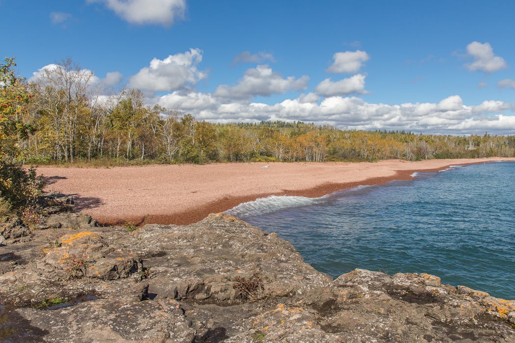 Iona's Beach Scientific and Natural Area (SNA) located near Two Harbors, Minn., features pink rocks chipped off nearby rhyolite cliffs.