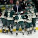 Coach Mike Yeo has a meeting with his players during a time out in the third period at Xcel Energy Center in St. Paul, MN on November 29, 2013. The Co