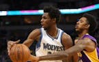 Los Angeles Lakers guard Nick Young (0) slapped the ball from Timberwolves forward Andrew Wiggins (22) in the first quarter but Wiggins got the last l