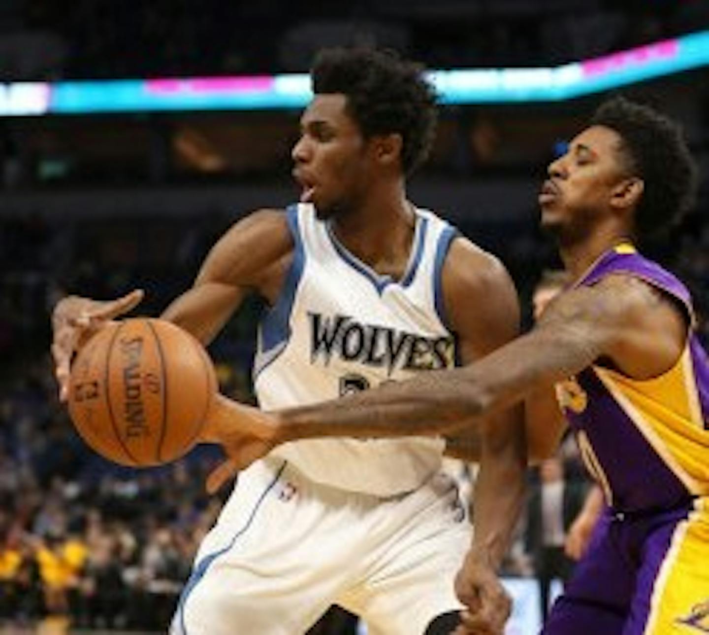 Los Angeles Lakers guard Nick Young (0) slapped the ball from Timberwolves forward Andrew Wiggins (22) in the first quarter but Wiggins got the last laugh with a career-high 47 points in the game.