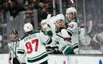 Minnesota Wild's Kirill Kaprizov celebrates his goal with teammates during the second period of an NHL hockey game against the Anaheim Ducks Wednesday