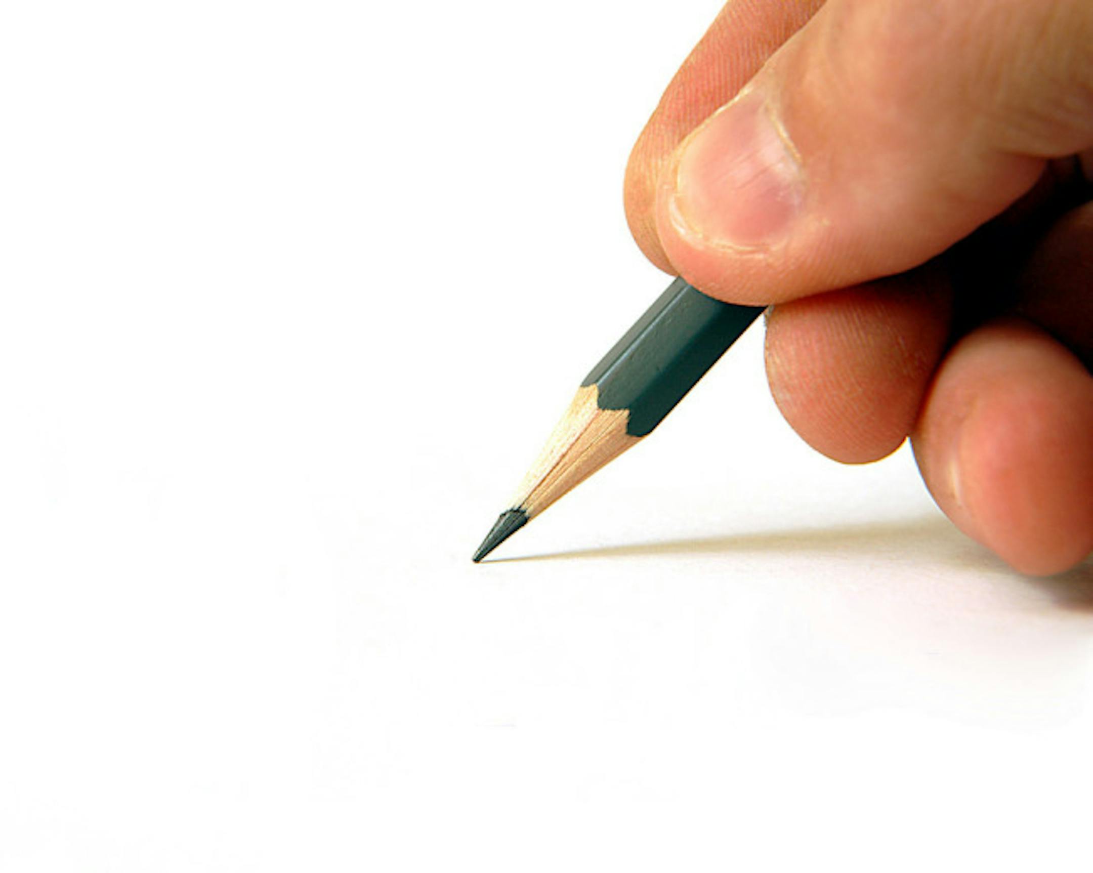 shutterstock hand holding a pencil