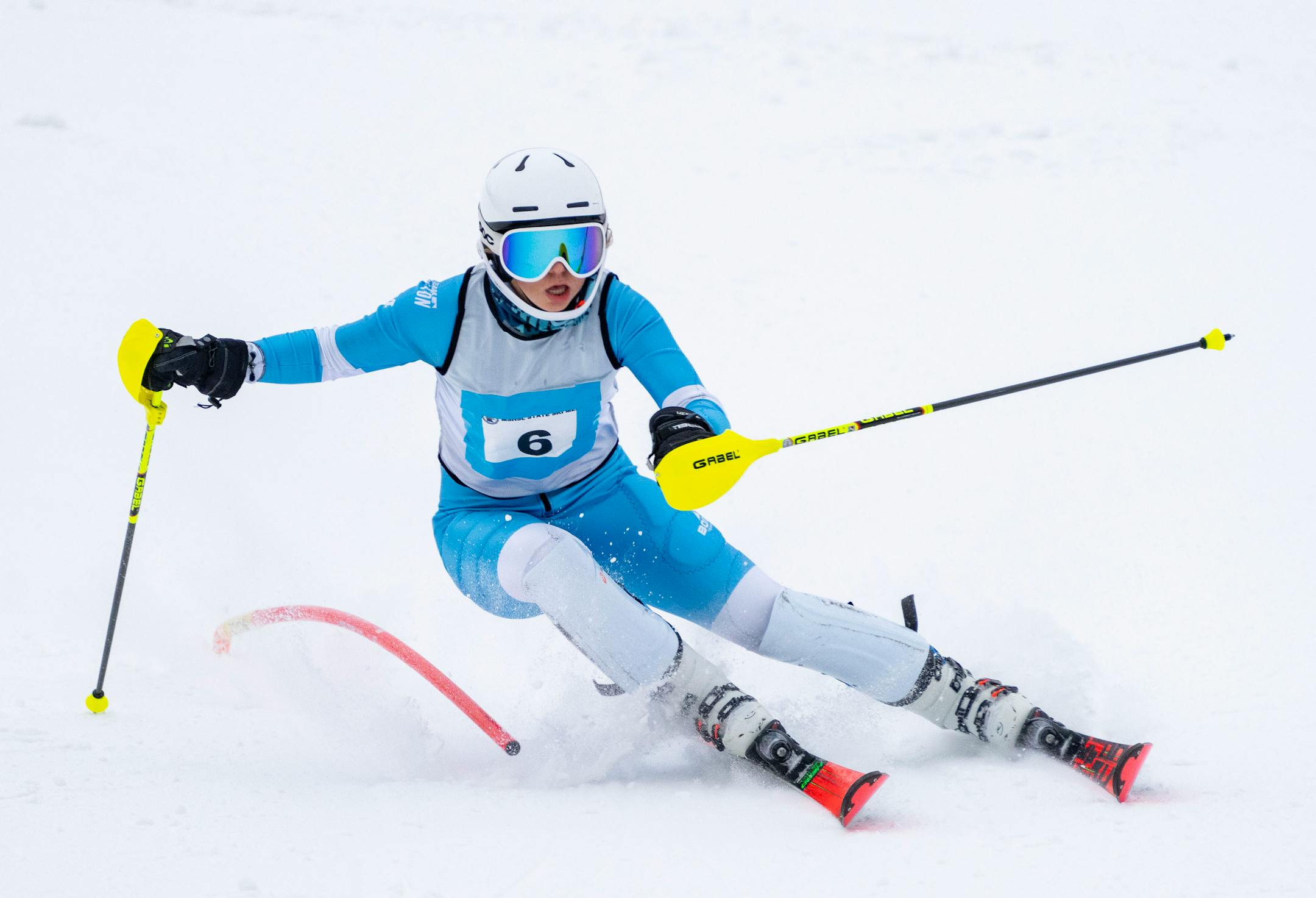 Hill-Murray alpine skier Taylor Voigt (6) passes through a gate in the first run of the MSHSL Boys and Girls Alpine Skiing State Meet Tuesday, Feb. 14, 2023 at Giant's Ridge in Biwabik, Minn. Voigt finished in first place with a combined run time of 1:15.32. ]