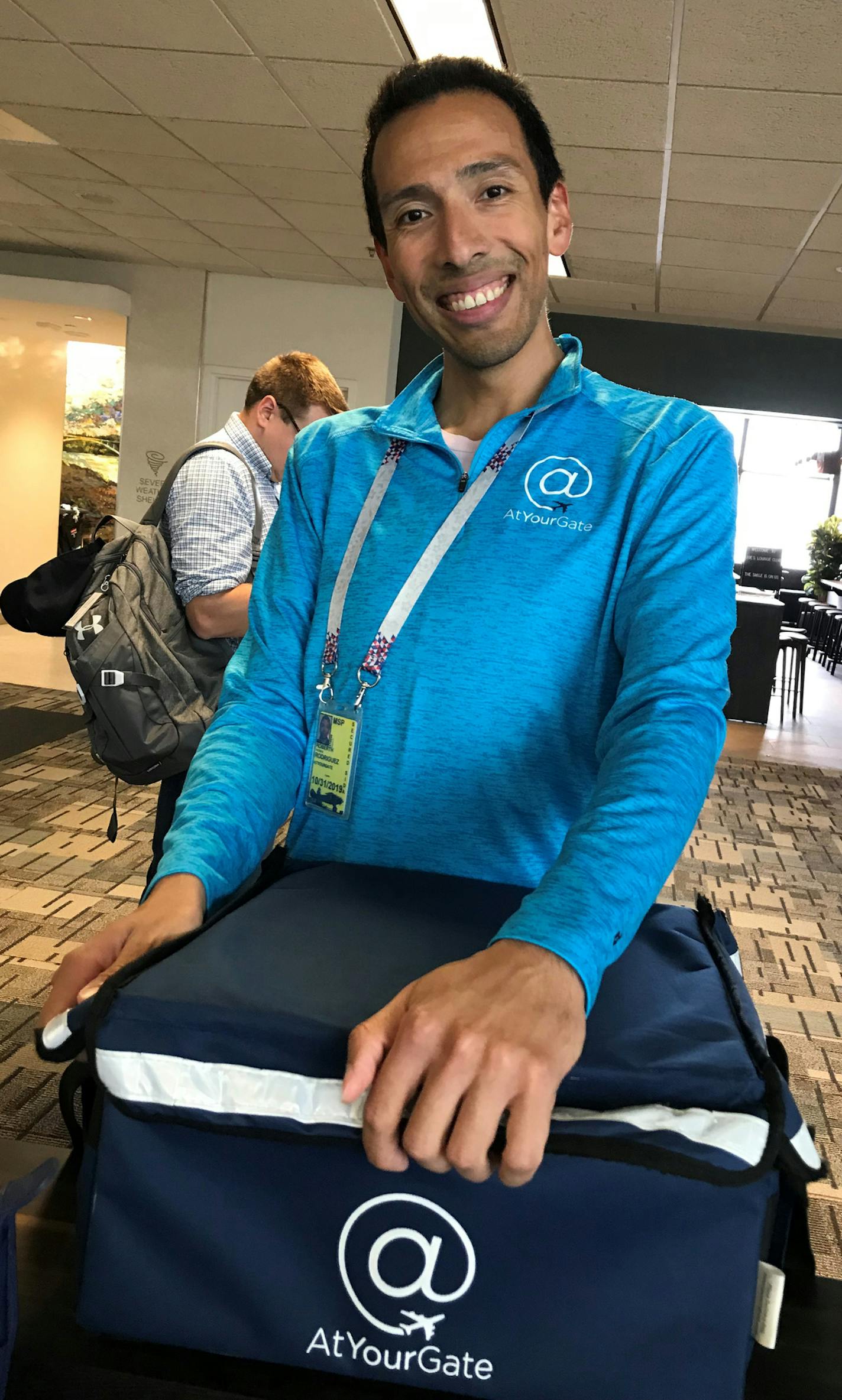 Robert Rodriguez has been delivering food AT MSP since December, when AtYourGate launched here.Photo by Kerri Westenberg