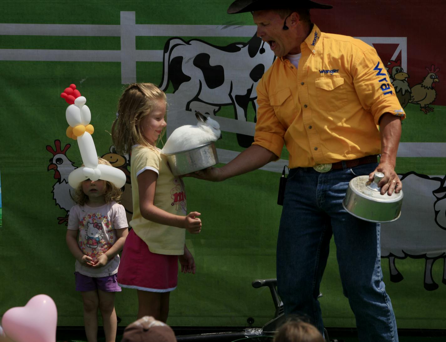 Noelle Boerboom of East Bethel assisted Brad Matchett of the Original Agricadabra show at the Ramsey County Fair in Maplewood in 2012.