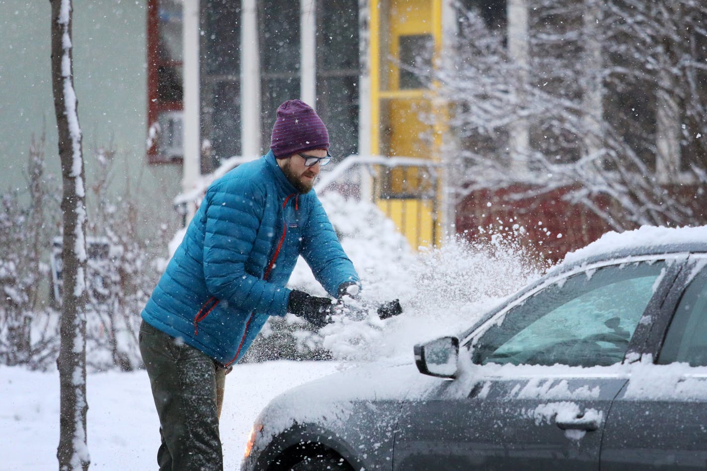 Northeast resident Stephen Wilson cleared snow off his car Wednesday morning.